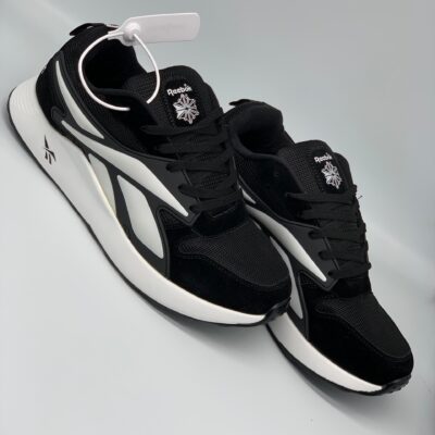 WHITE AND BLACK REEBOK SNEAKERS